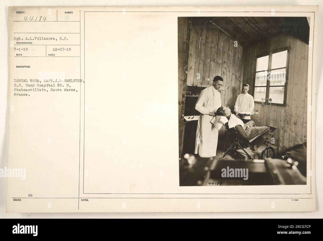 sergeant-al-villanova-from-the-signal-corps-is-photographed-in-the-dental-room-with-captain-jl-smeltzer-dc-at-camp-hospital-no-9-in-chateauvillain-haute-marne-france-the-photo-was-taken-on-december-27-1918-and-the-.jpg